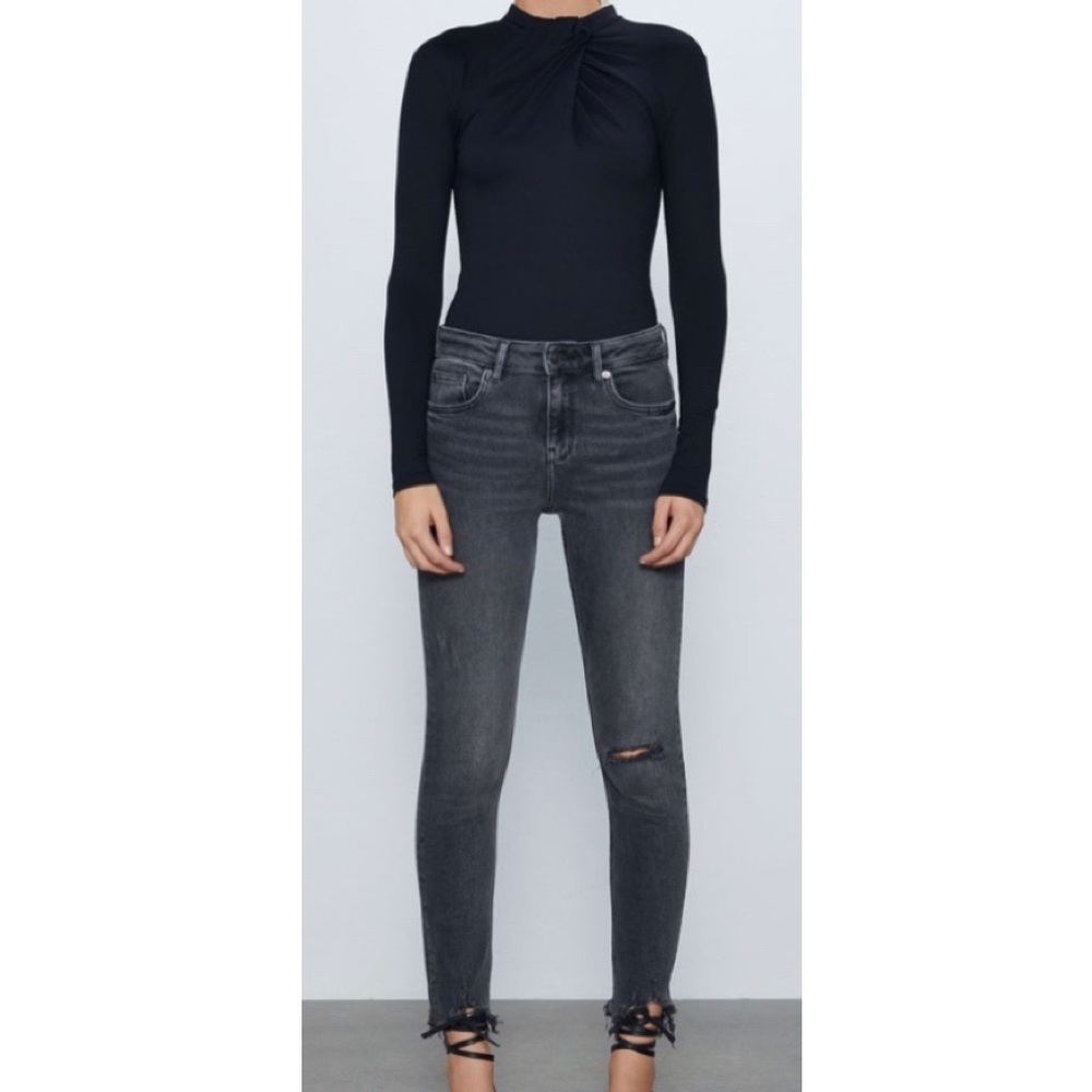 Faded black distressed jeans
